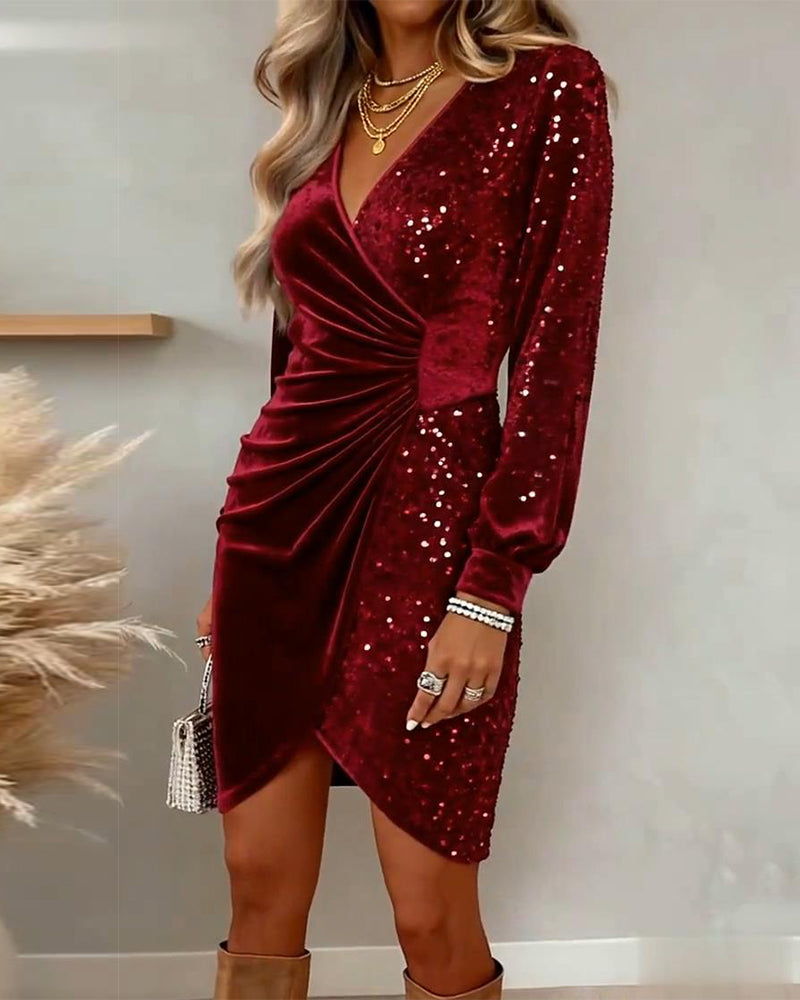 Elegant women's dress with sequins and asymmetric gathering