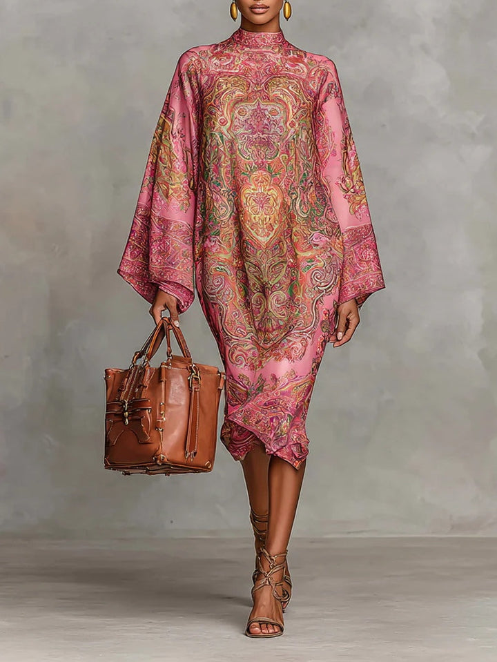 Pink midi dress with paisley pattern, featuring wide sleeves and long sleeves.