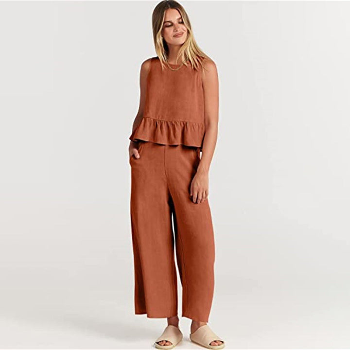 Wide women's trousers and women's blouse with ruffle