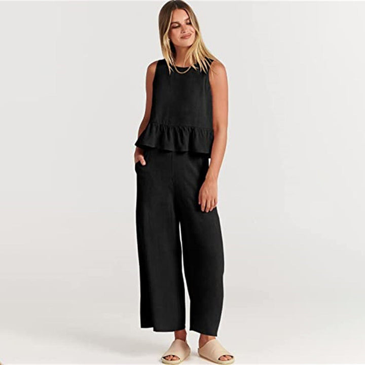 Wide women's trousers and women's blouse with ruffle