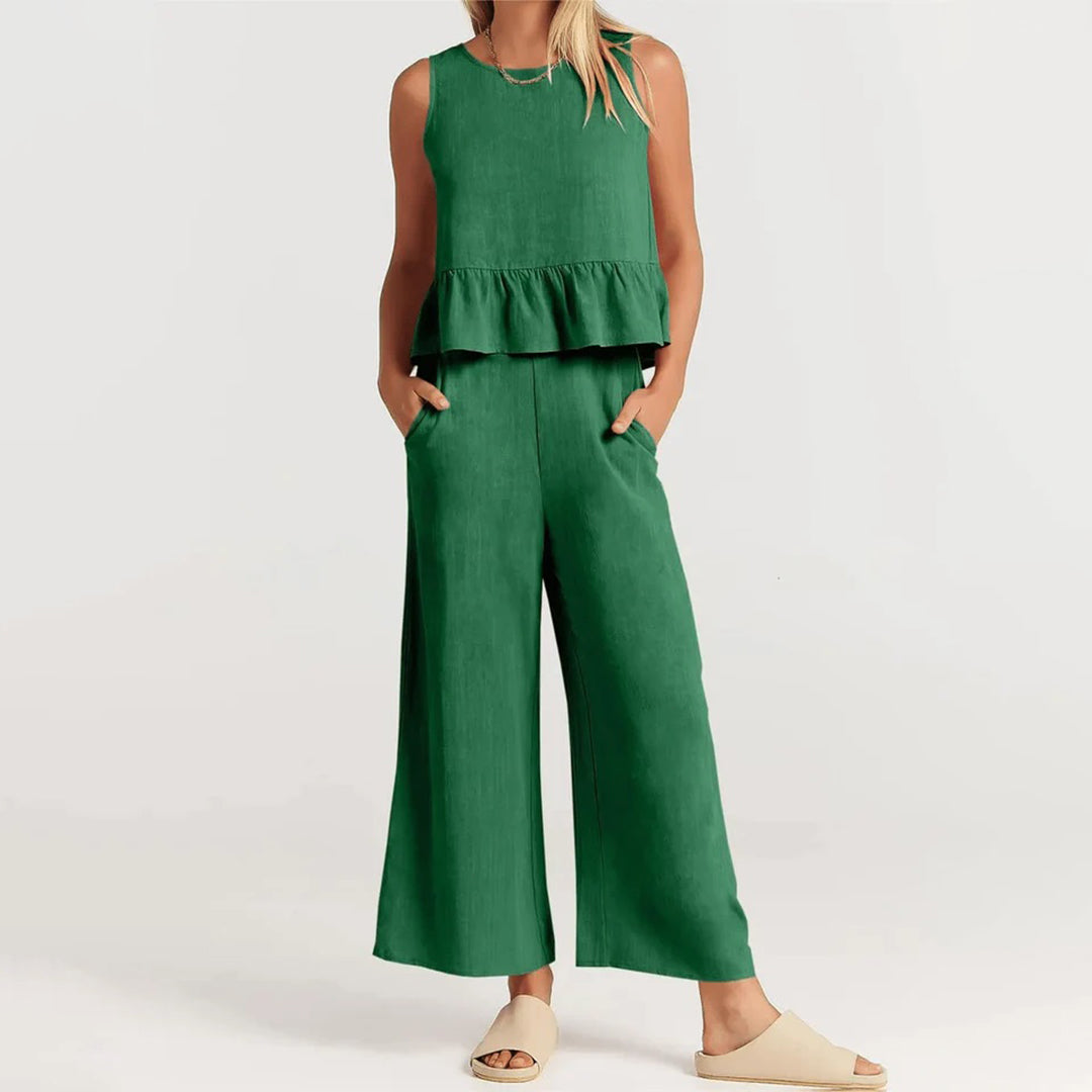 Wide women's trousers and women's blouse with ruffle