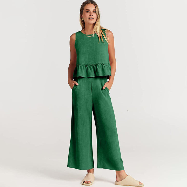 Wide women's trousers and women's blouse with ruffle