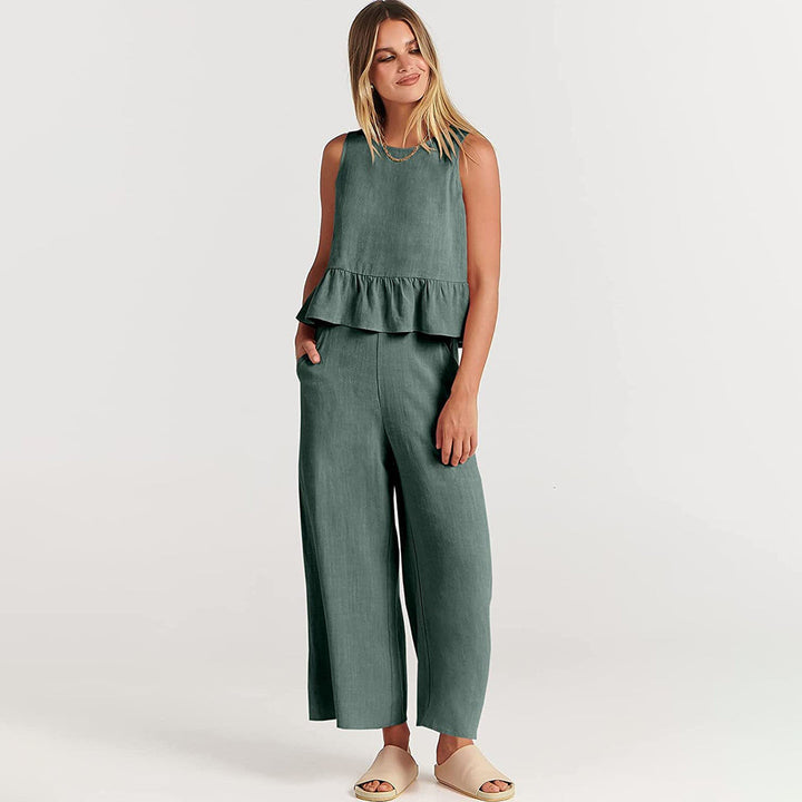 Wide women's trousers and women's blouse with ruffle
