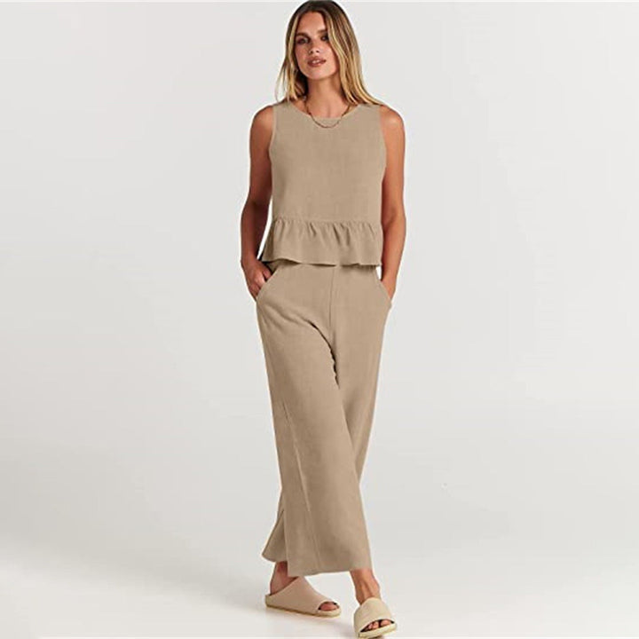 Wide women's trousers and women's blouse with ruffle