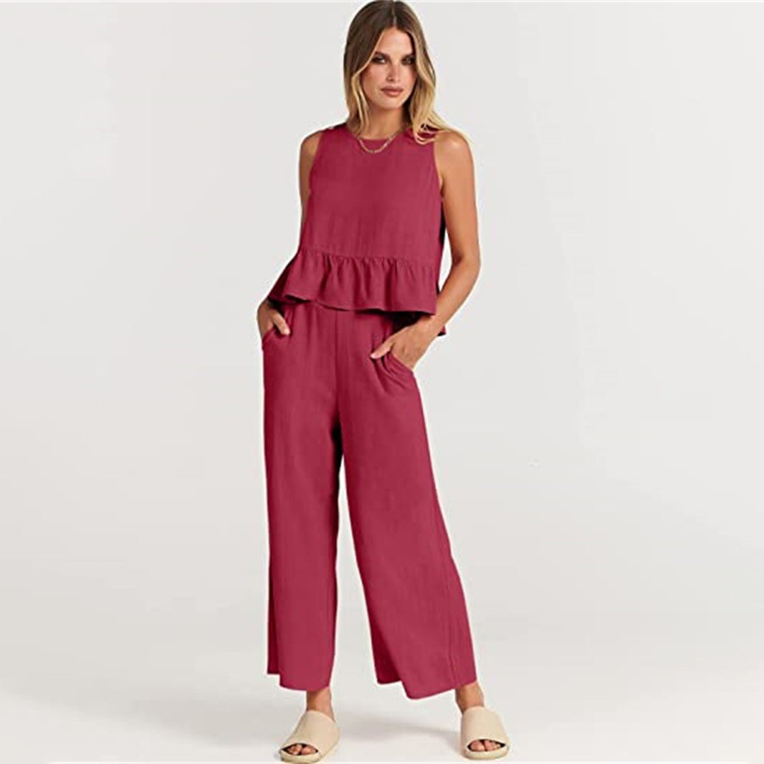 Wide women's trousers and women's blouse with ruffle