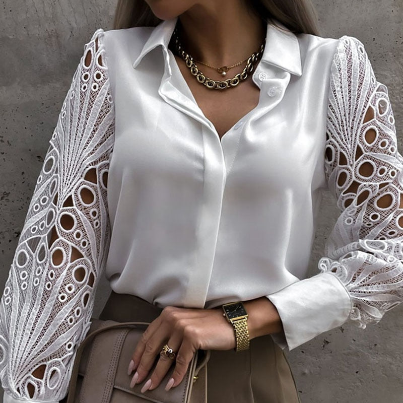 Women's blouse with a collar and lace sleeves with buttons