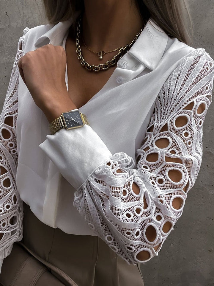 Women's blouse with a collar and lace sleeves with buttons
