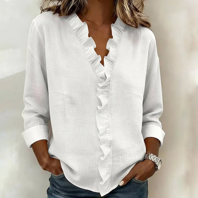 Women's blouse with ruffle at the neckline and long sleeves