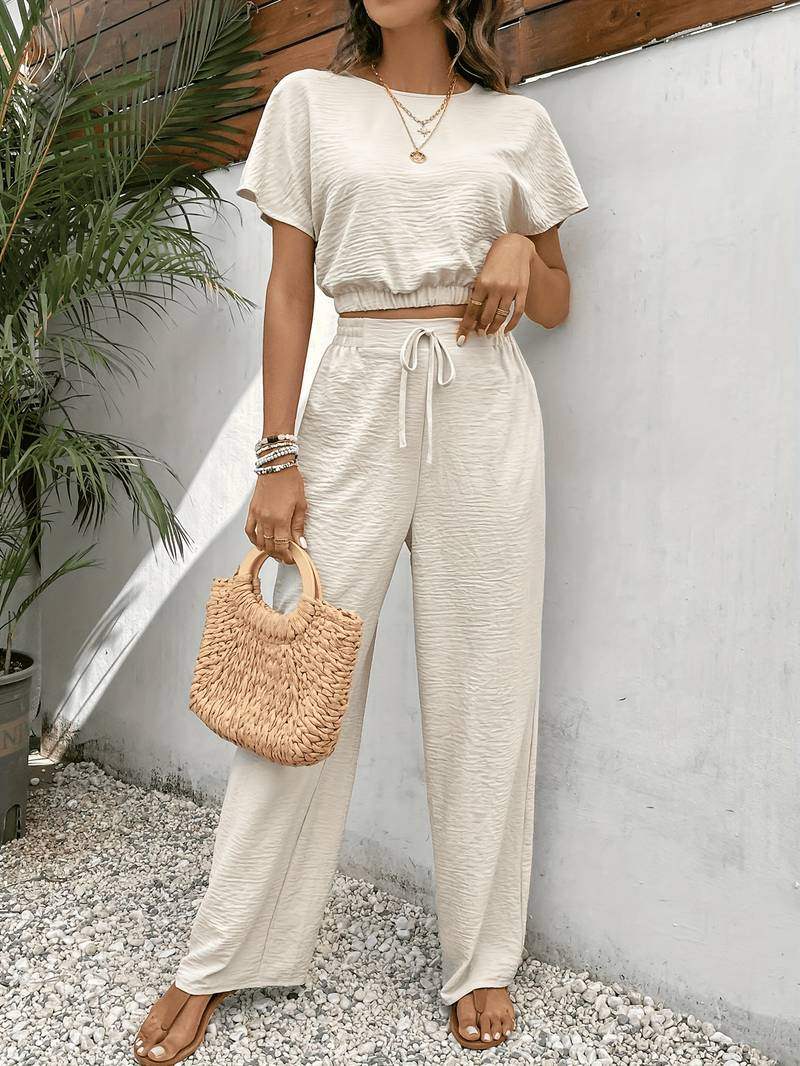 Women's complete set: blouse and pants with a waist tie