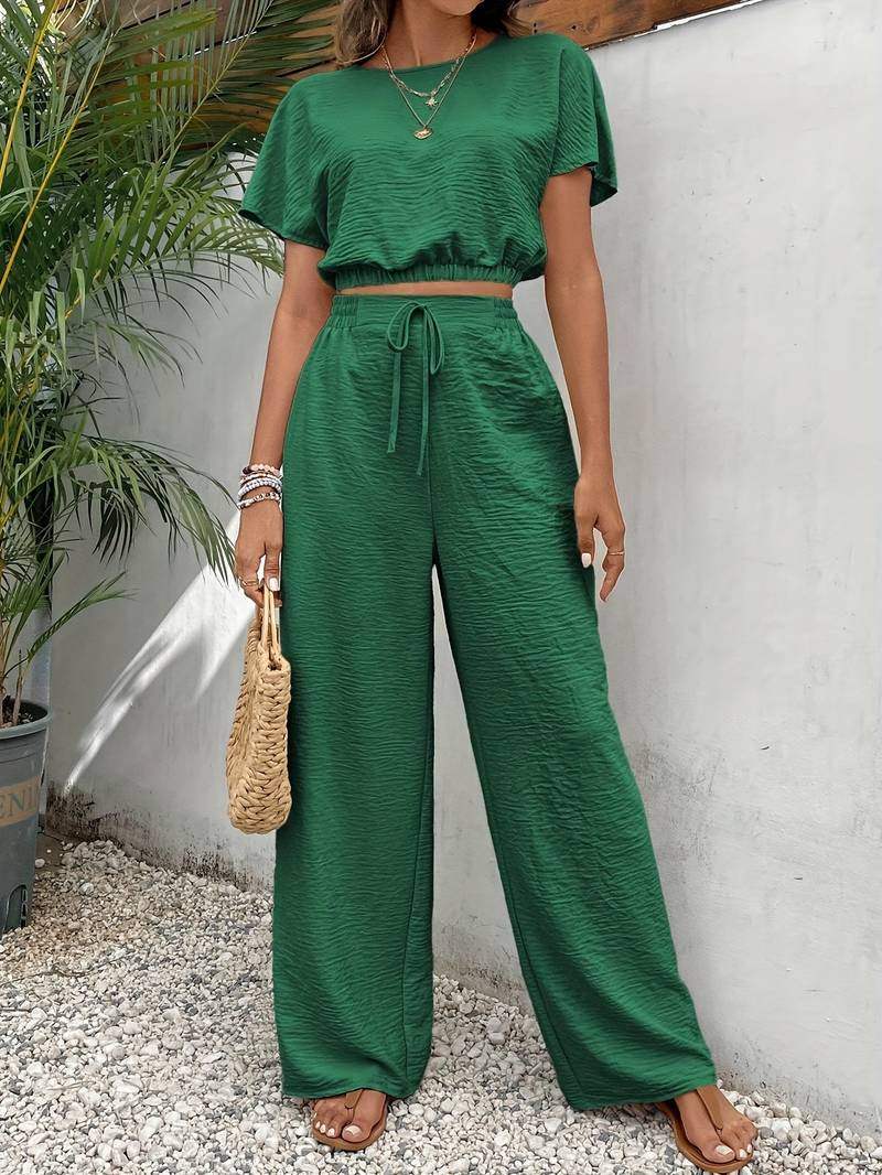 Women's complete set: blouse and pants with a waist tie